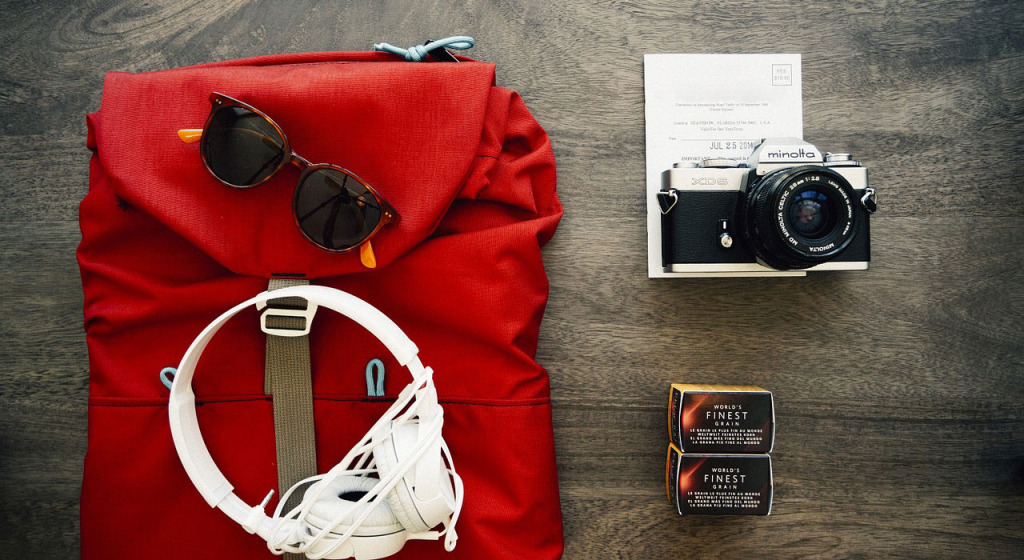 backpack, sun glasses and camera